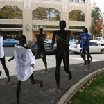 Riverfront Park statues dressed in INL shirts and white canes