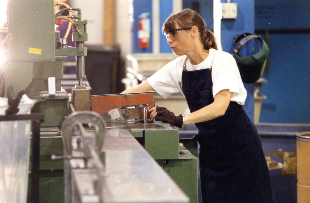 Debbie Sommer working in the Machine Shop in the 90s